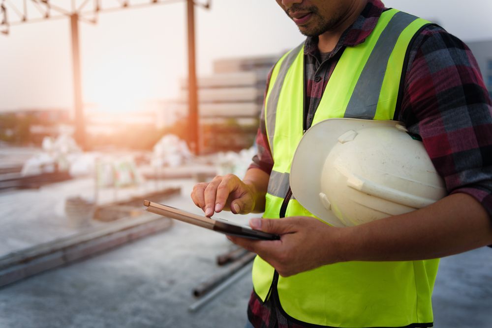 construction worker doing pre-demolition work and assessing risk for a demolition project