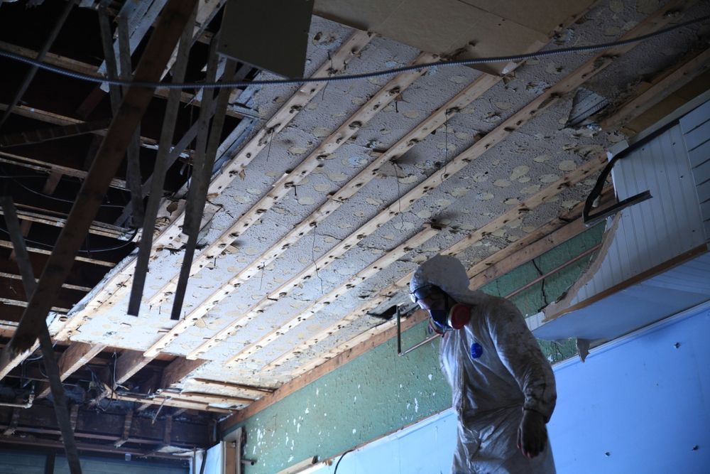 demolition worker doing an Asbestos Survey as part of demo risk assessment