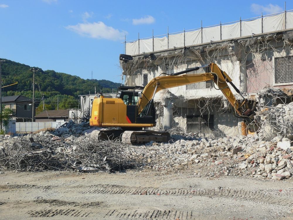An aerial view of a stadium being demolished.