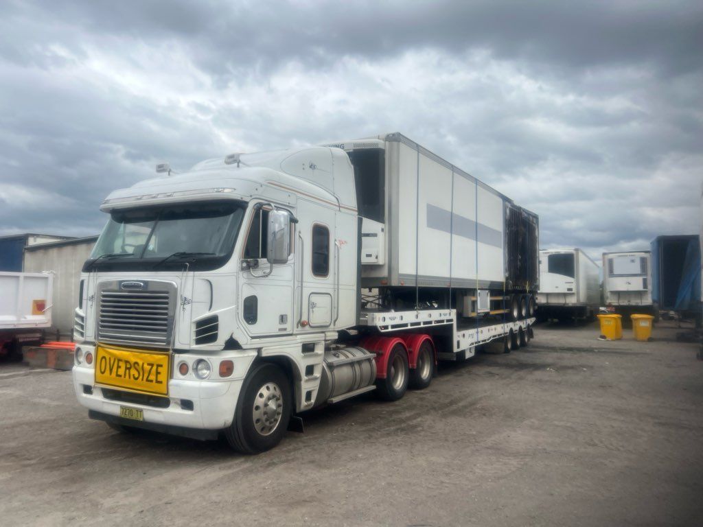Bus on the Back of a Tow Truck — Alpine Towing Services in Lismore, NSW