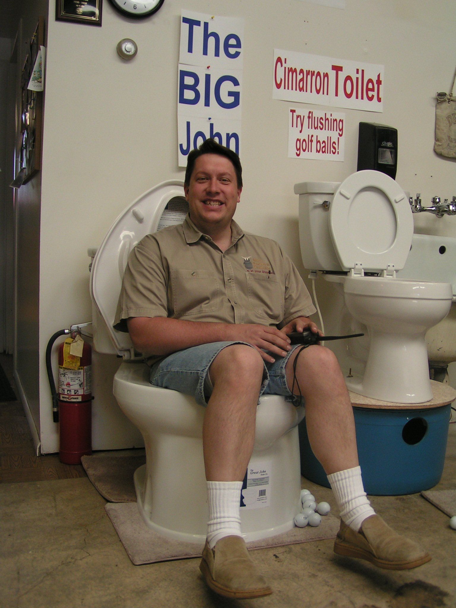 Smiling Man While Sitting in a Toilet — Ogden, UT — Mike Bachman Plumbing