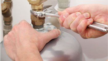 Technician Installing the Water Heater — Ogden, UT — Mike Bachman Plumbing