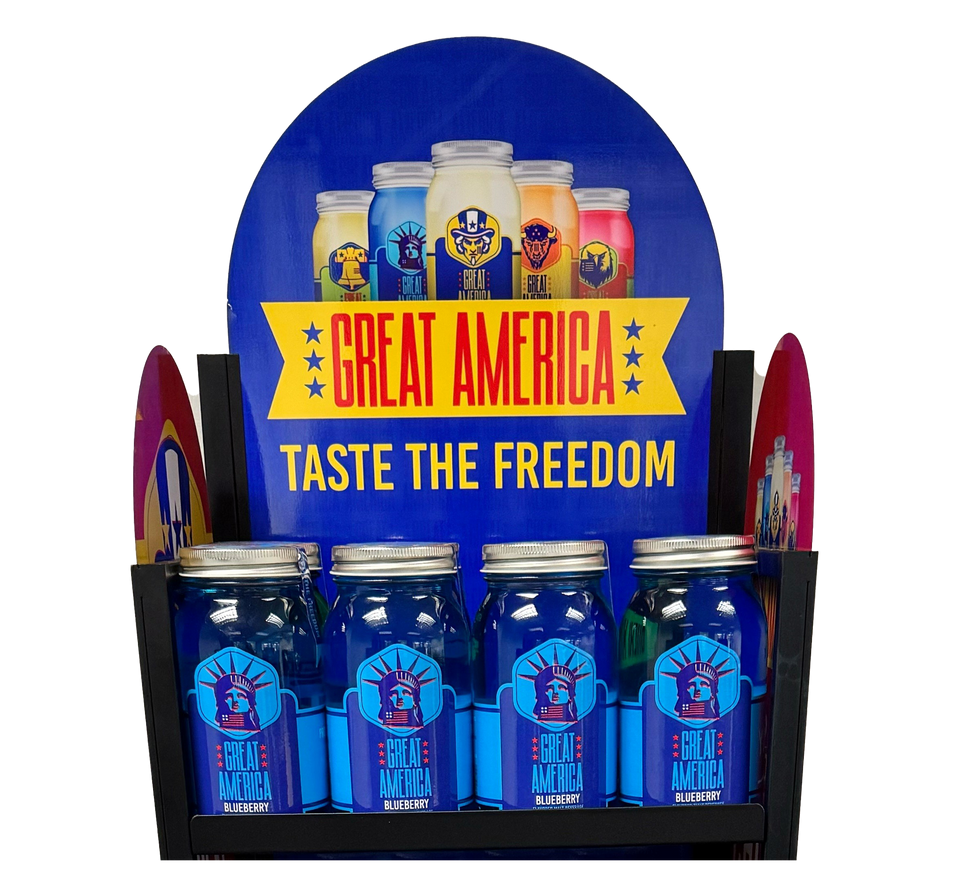 Display of "Great America" jars in a store, blue with labels, featuring the Statue of Liberty.