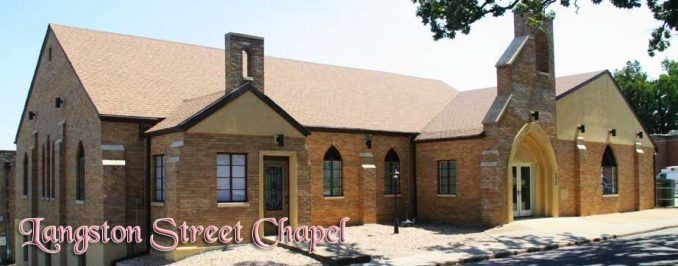 Langston Street Chapel: a tan brick church building with a peaked roof and a small bell tower under a blue sky.