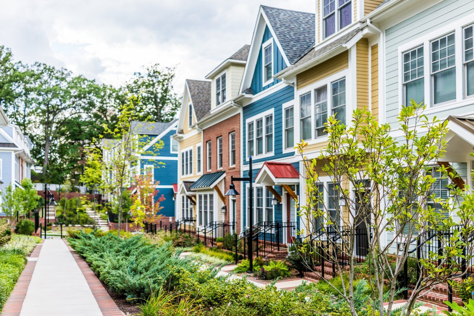 A row of colorful houses in a residential neighborhood