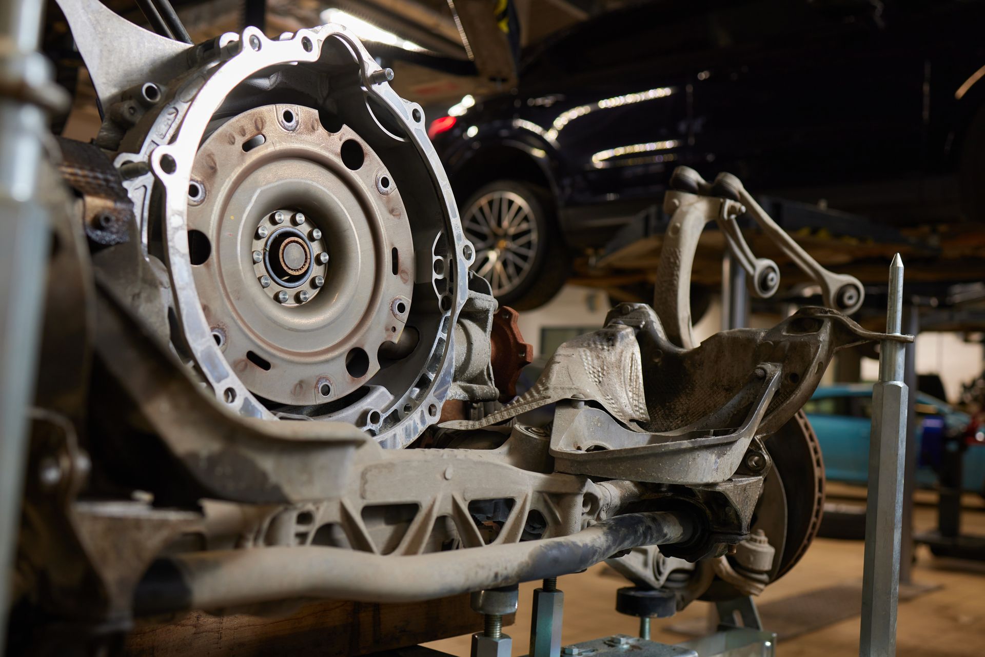 A car engine is being worked on in a garage.