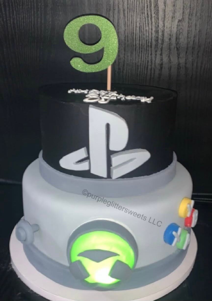 A birthday cake with a playstation logo on it