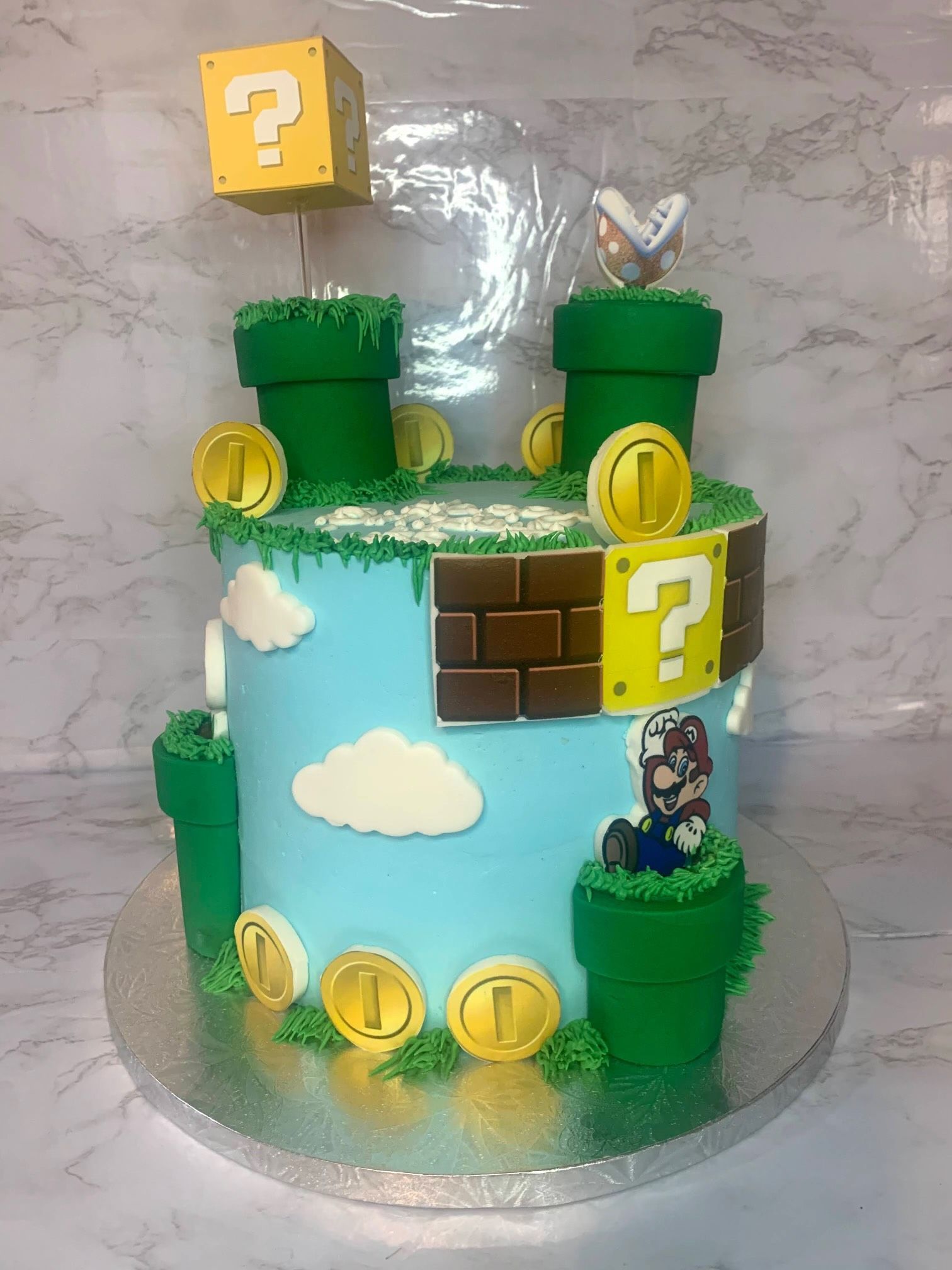 A cake decorated to look like a mario game is sitting on a table.
