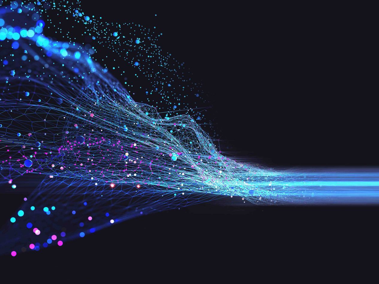 A computer generated image of a blue and purple wave on a black background.