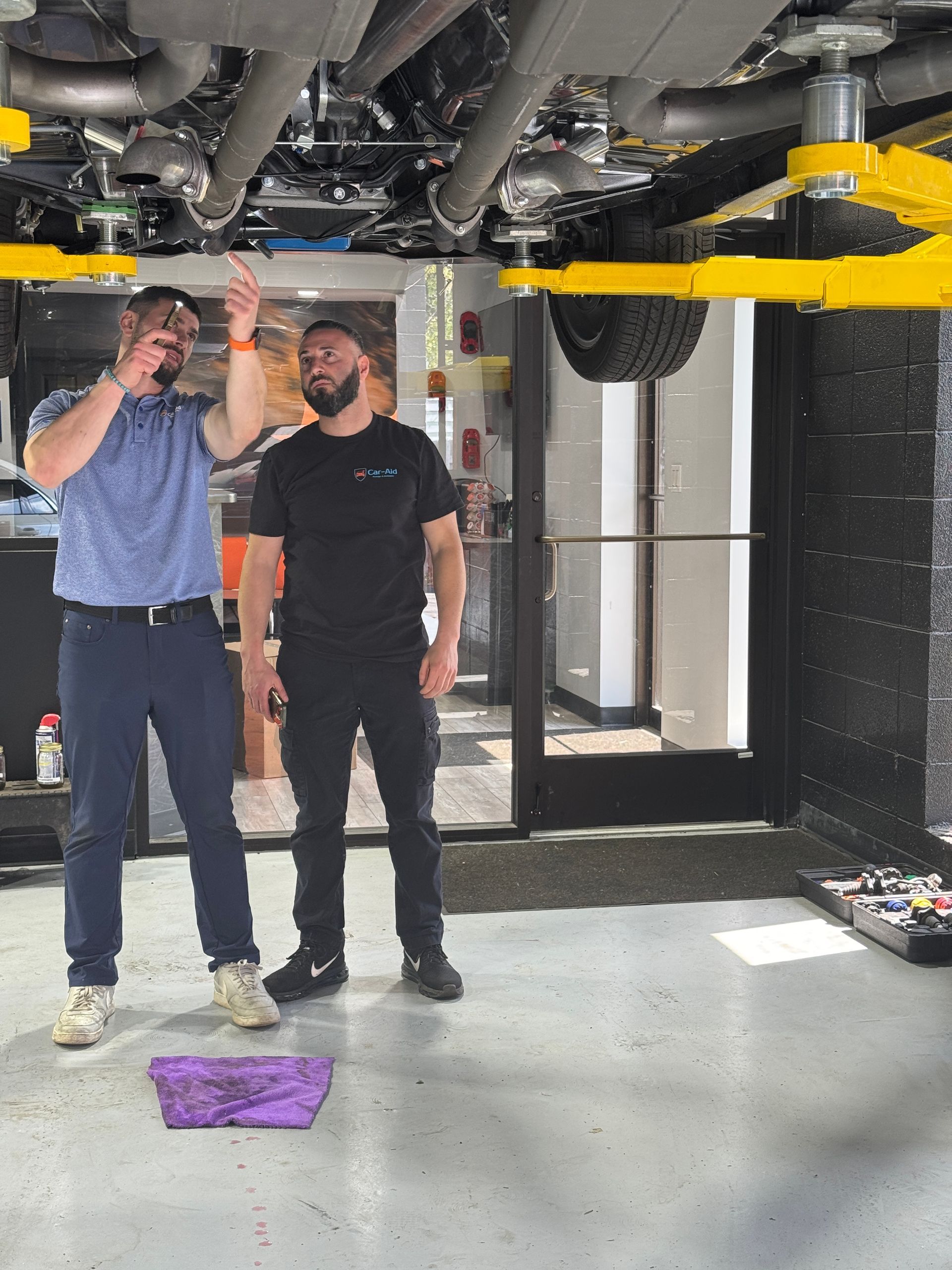 Mechanic doing diagnostics on car