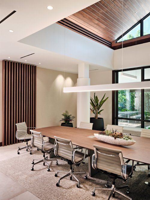 A conference room with a long table and chairs
