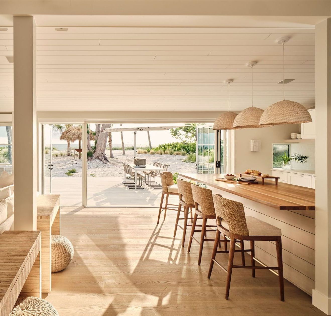 A kitchen with a long wooden table and chairs
