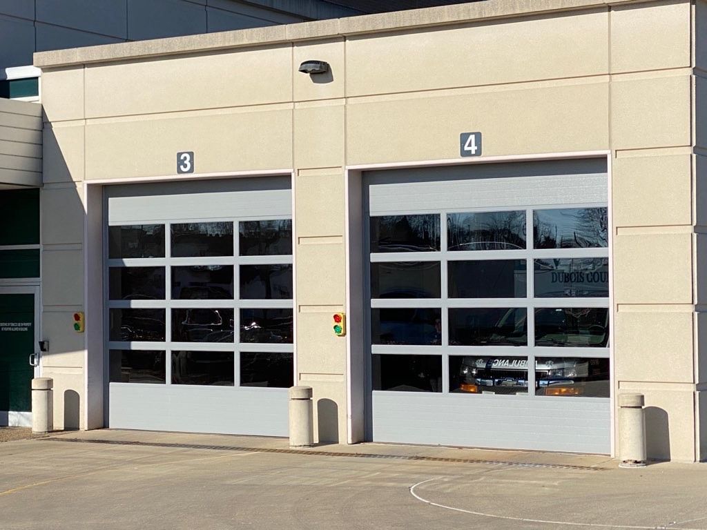 Two garage doors with the number 3 and 4 on them