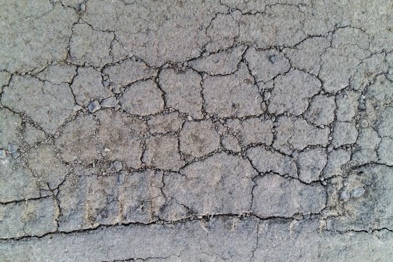 Cracked pavement in parking lot