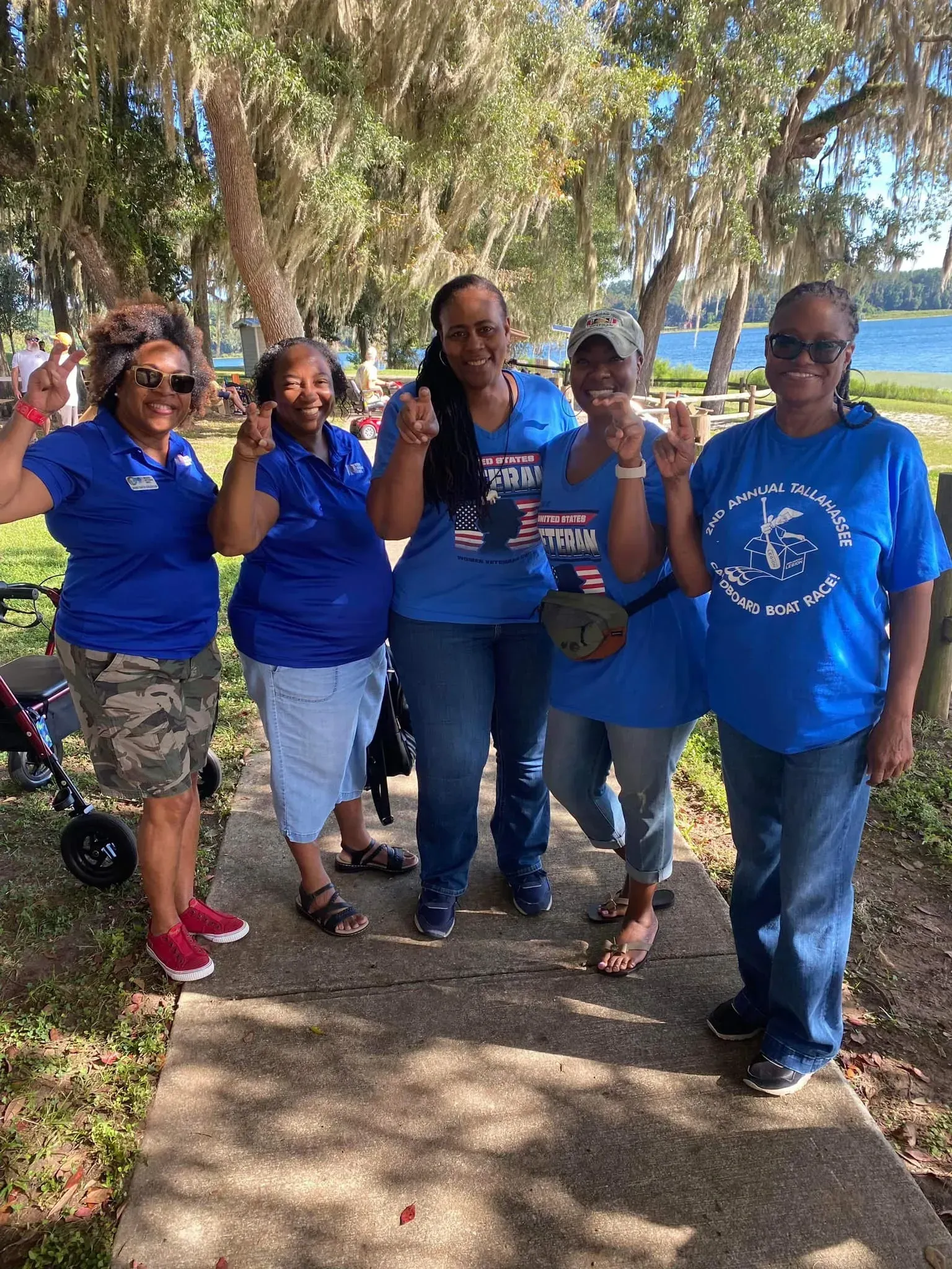 A person is holding a pineapple in a bag in a grocery store.