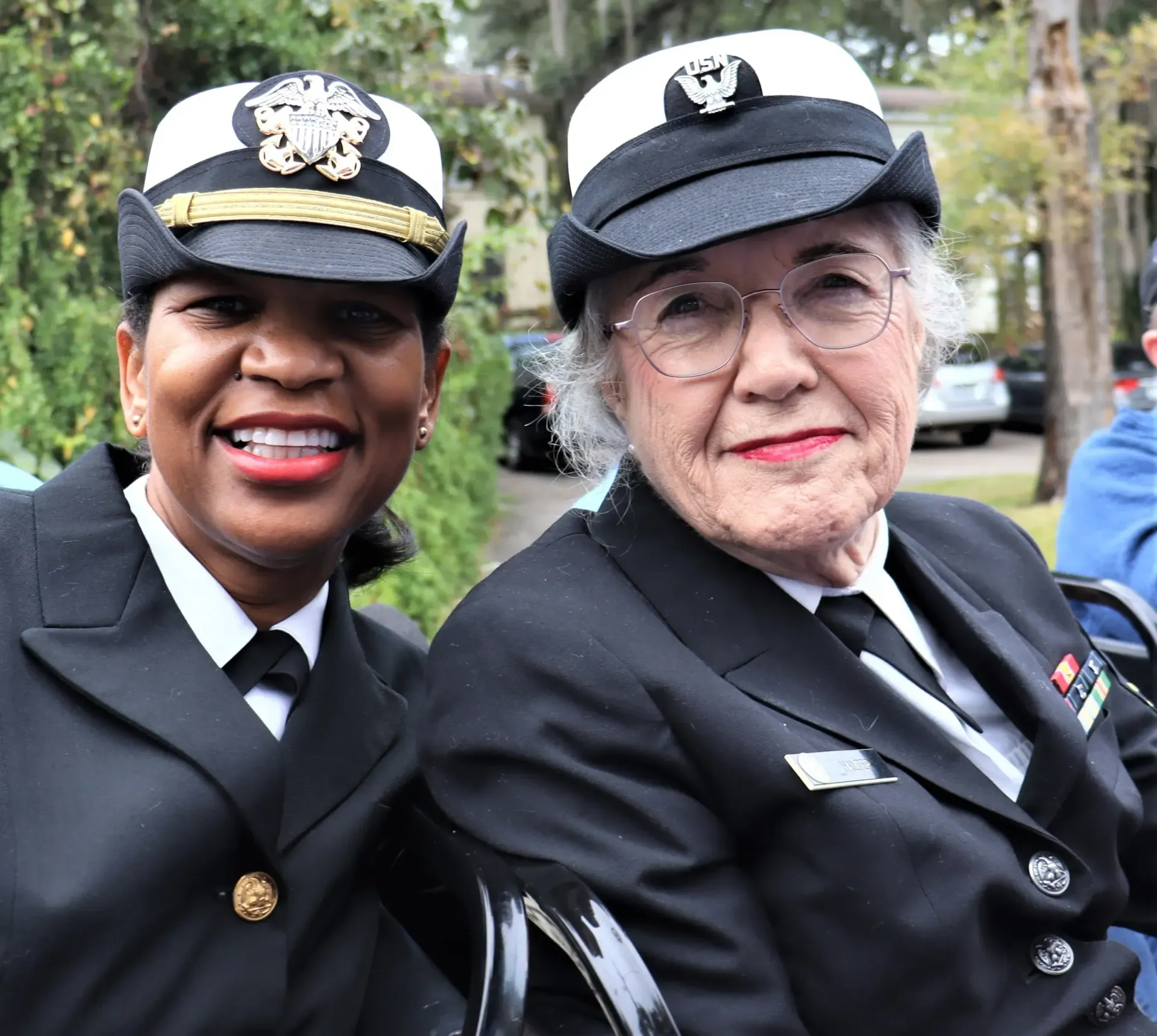 A person is holding a pineapple in a bag in a grocery store.