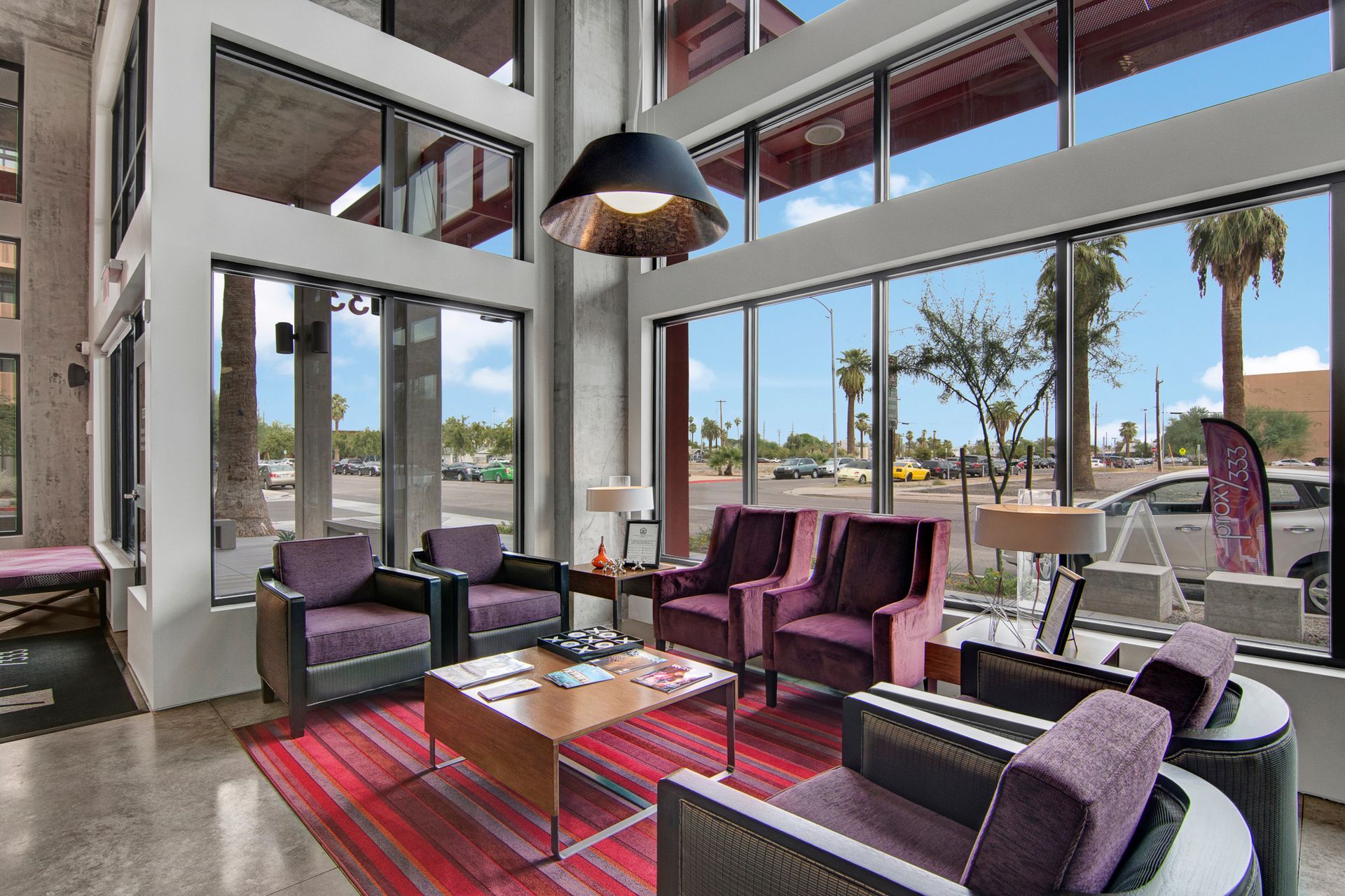 A living room filled with furniture and a large window.