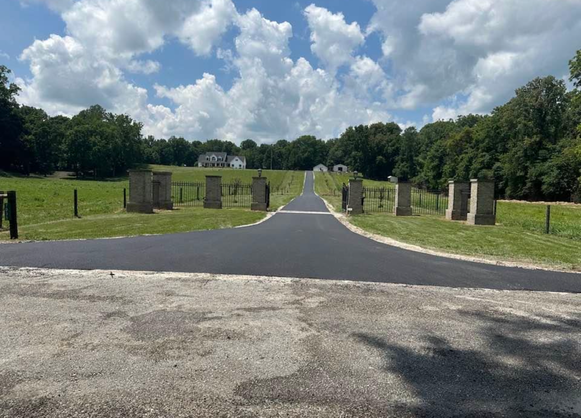 A road going through a cemetery on a sunny day