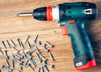 Power Drill with screws and wood from L.I. Hardware