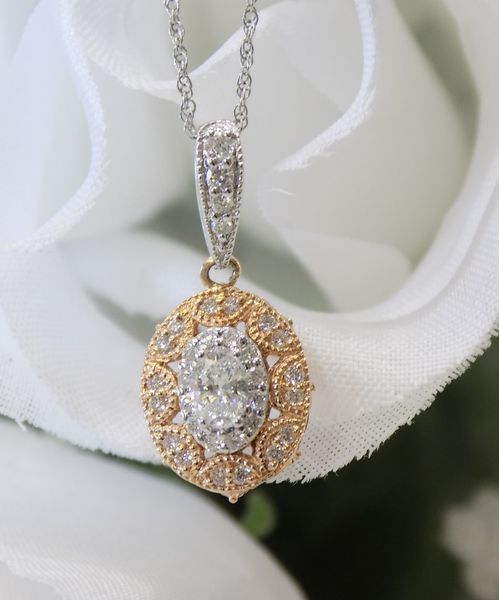 Diamond pendant necklace with oval design
