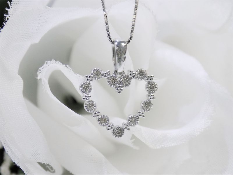 Diamond heart pendant on white chain