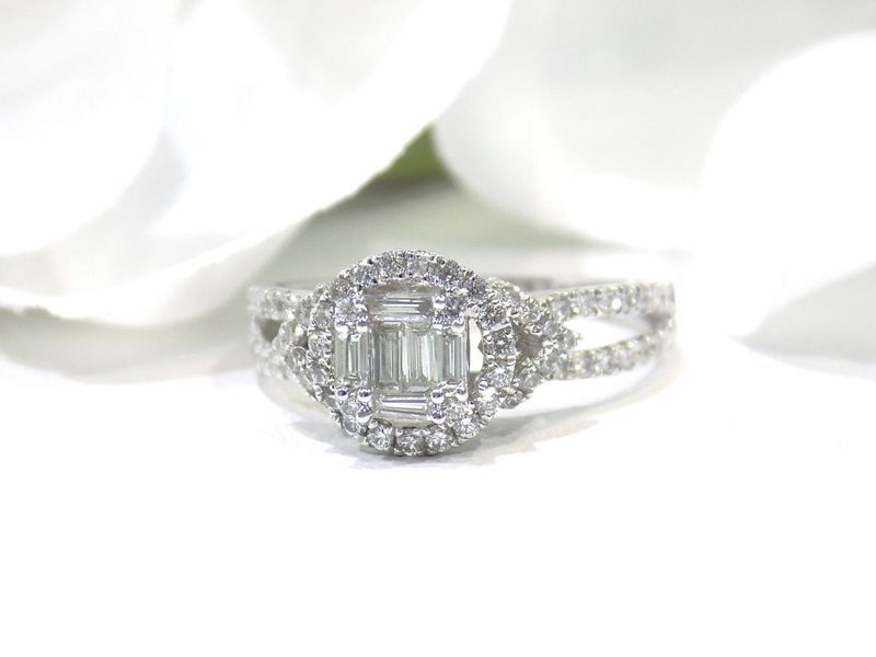 Diamond engagement ring with a central emerald-cut stone