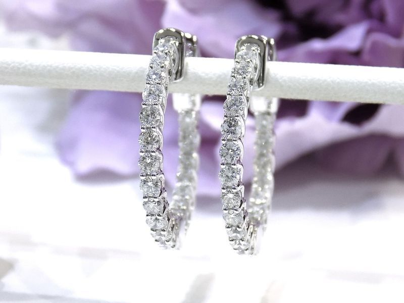 Diamond hoop earrings displayed on a white background