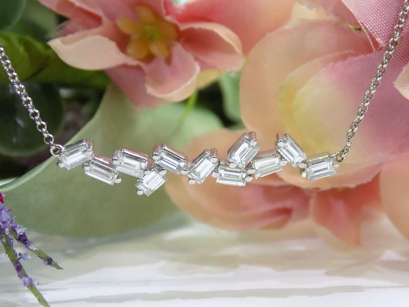Diamond baguette necklace on a white background