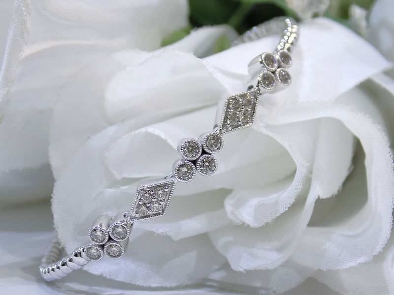 Diamond bracelet on white floral background