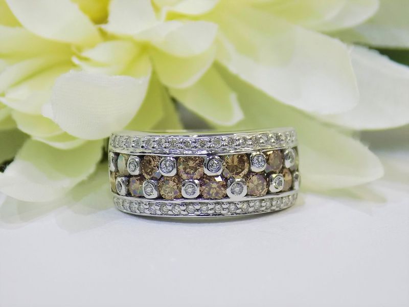 Wide band ring with brown and clear diamonds set