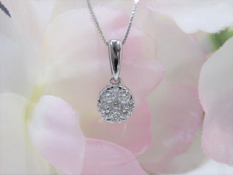 Silver pendant necklace with a cluster of diamonds