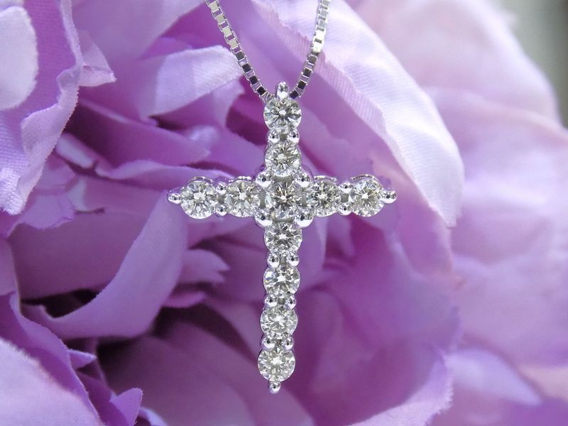 Diamond cross pendant on a silver chain