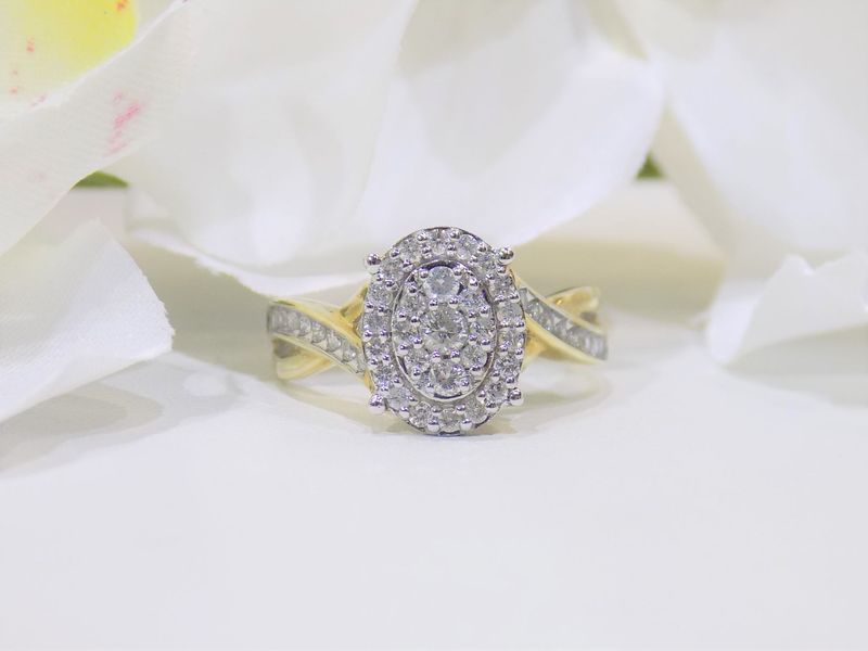 Diamond ring with oval cluster