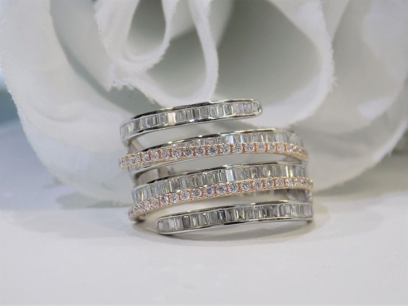 Spiral ring with white and pink diamonds