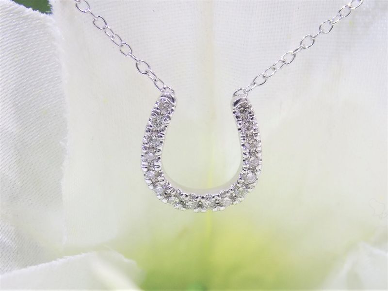 Horseshoe pendant necklace with diamonds