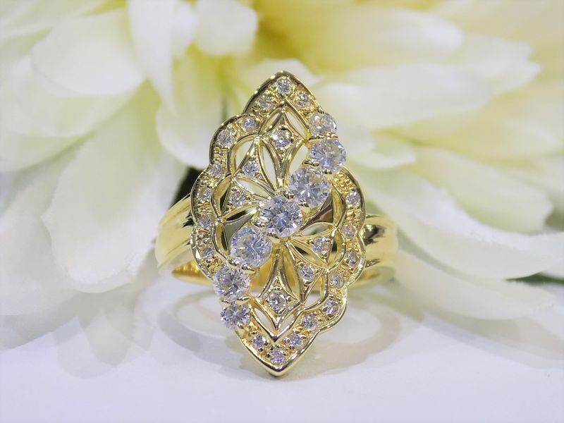 Gold ring with diamonds in an ornate