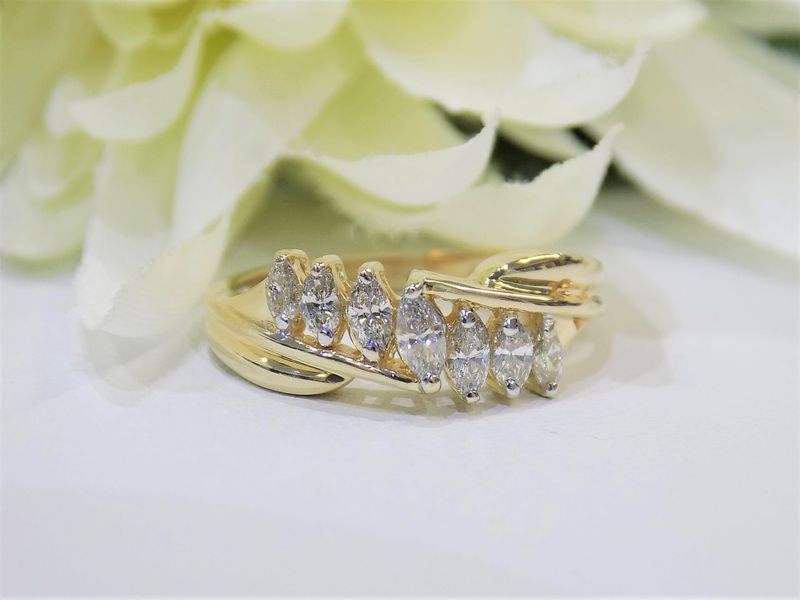 Gold ring with seven marquise-cut diamonds