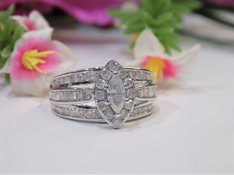 Diamond ring with marquise center stone