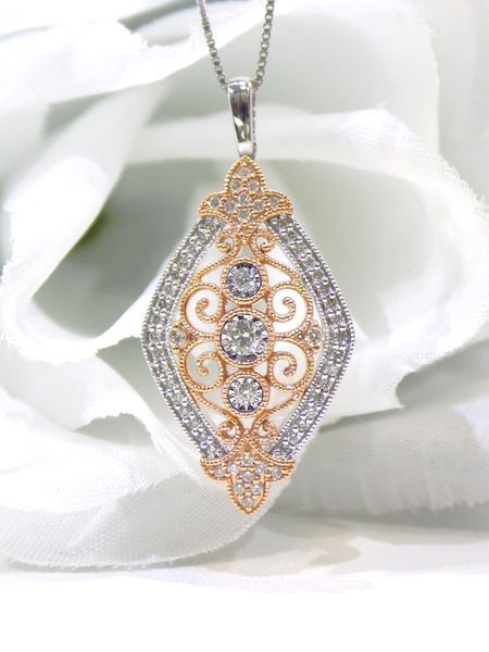 Diamond pendant necklace with gold filigree and diamonds