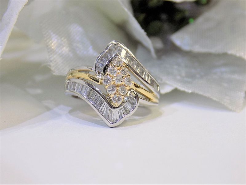 Diamond ring with a gold and white metal band