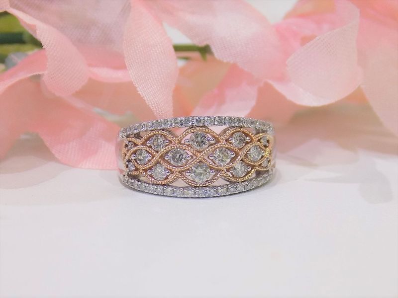 Two-tone diamond ring with intricate openwork design