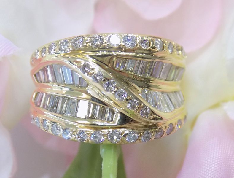 Gold ring with alternating bands of baguette and round diamonds
