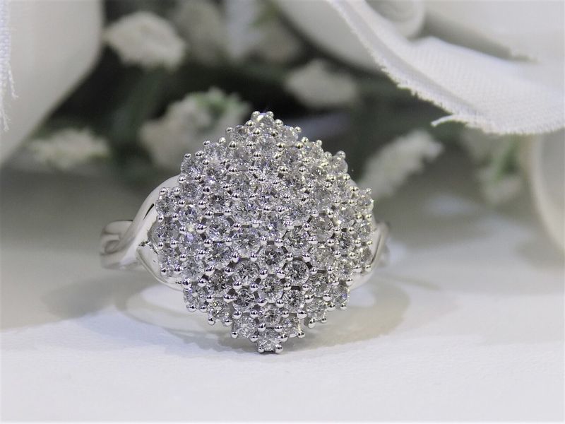 Diamond cluster ring on white surface