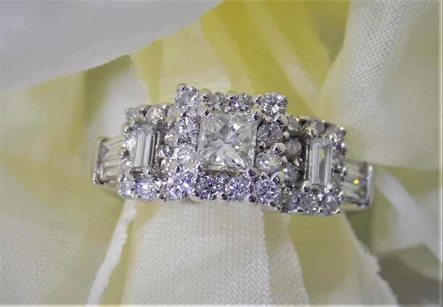 Diamond ring on white fabric