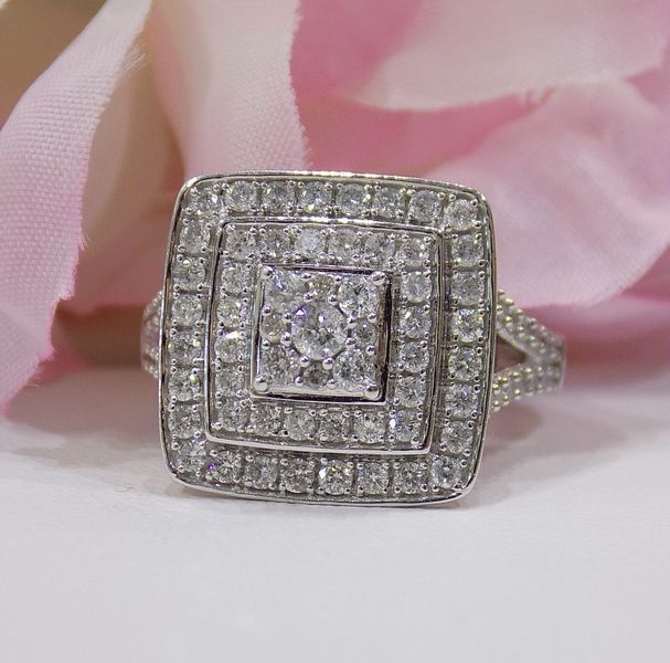 Diamond ring with a square halo of diamonds