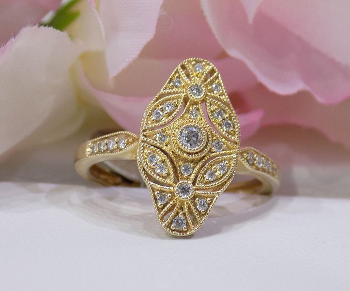 Gold filigree ring with diamond accents