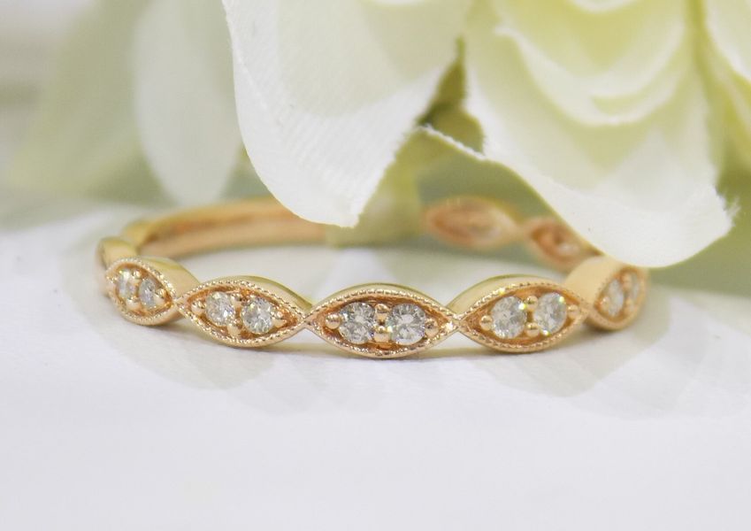 Gold ring with marquise-shaped settings