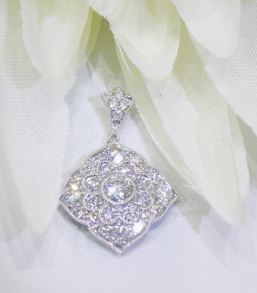 Diamond pendant with a flower-like design