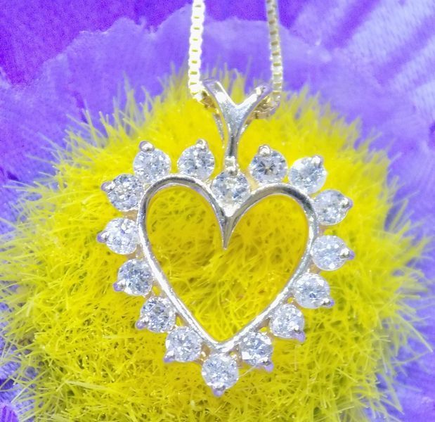 Heart-shaped diamond pendant on gold chain