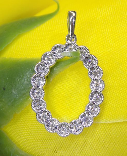 Oval-shaped pendant with small diamonds set in silver